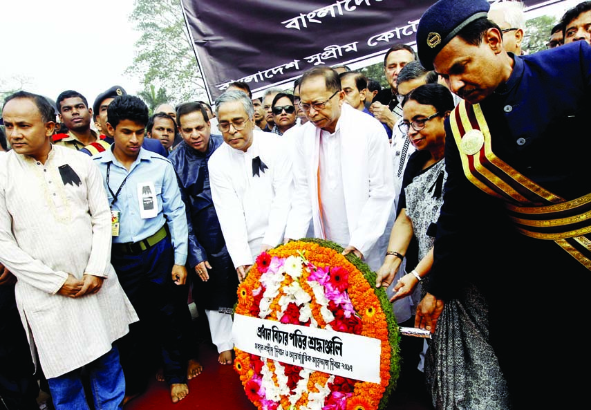 Chief Justice of Bangladesh SK Sinha placing wreaths at the altar of Central Shaheed Minar on Tuesday.