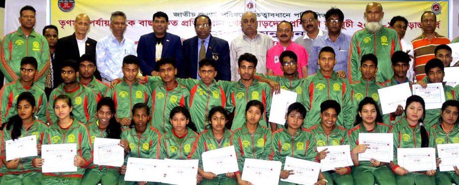 The selected wrestlers from grass-root level and the chief guest Secretary of National Sports Council (NSC) Ashok Kumar Biswas and the guests and officials of Bangladesh Amateur Wrestling Federation pose for a photo session at the gymnasium of NSC on Wedn