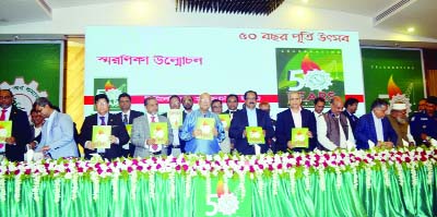 SYLHET: Finance Minister Abul Maa Abdul Muhith MP unwrapping cover of the memorial book markin the Silver Jubilee of Sylhet Chamber of Commerce and Industry yesterday.