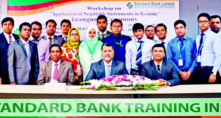 Mamun-Ur-Rashid, MD and CEO of Standard Bank Limited poses with the participants of a workshop on 'Application of Negotiable Instruments in Banking' at the bank's training institute in the city recently. Md Zakaria, Principal and Md Amzad Hossain Fakir