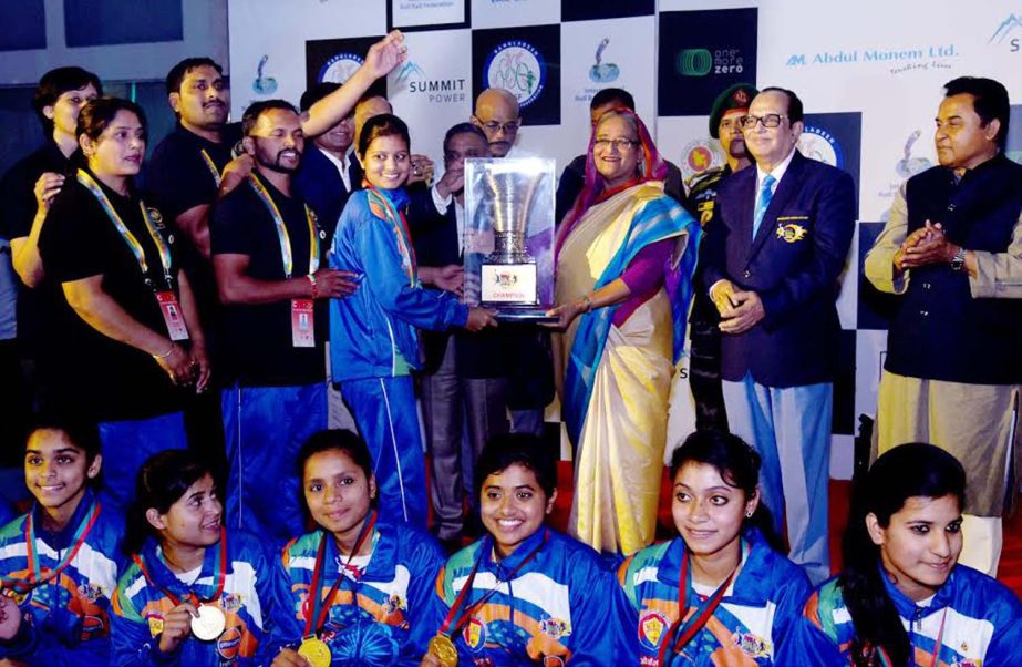 Prime Minister Sheikh Hasina handing over the championship trophy of the 4th Rollball World Cup to India Women's Rollball team at the Sheikh Russel Roller Skating Complex on Thursday.