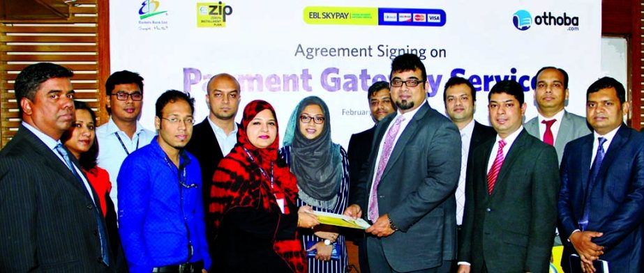 M Nazeem A Choudhury, Head of Consumer Banking of Eastern Bank Ltd (EBL) and Uzma Chowdhury, Director Finance, PRAN-RFL Group exchanging documents after signing a zero percent installment plan (ZIP) and online payment processing agreement in the city rece