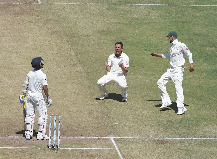 Steve O'Keefe is thrilled after taking a wicket on the 2nd day of the 1st Test between India and Australia at Pune in India on Friday.