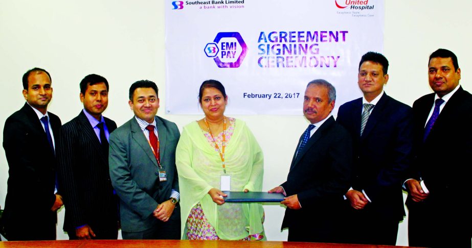 Md Abdus Sabur Khan, Head of Cards of Southeast Bank Limited and Dr Shagufa Anwar, Chief of Communication and Business Development of United Hospital Limited exchanging documents after signing an agreement the city recently. Under the agreement credit car