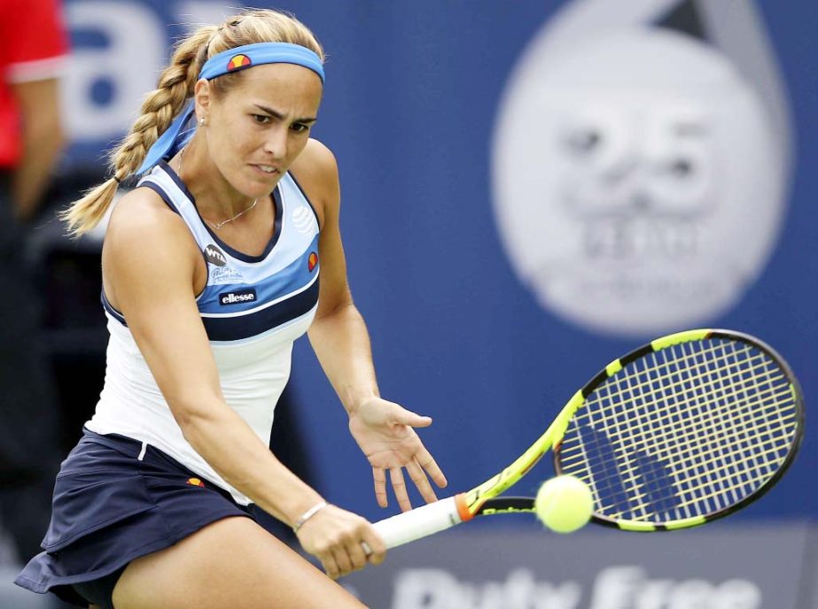 Monica Puig of Portugal returns the ball to Yaroslavl Shvedova of Kazakhstan during the Dubai Tennis Championships in Dubai, United Arab Emirates on Monday.