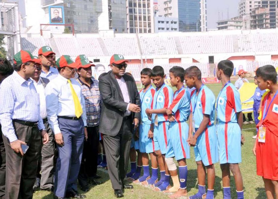 State Minister for Health and Family Welfare Dr Zahid Malik being introduced with the participants of the Bangabandhu Gold Cup Primary School Football Tournament at the Bangabandhu National Stadium on Saturday.