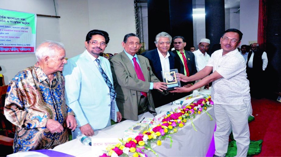Former Justice of Appellate Division of Bangladesh Supreme Court Joynal Abedin Khan handing over Sher-e-Bangla Gold Medal to the Deputy Managing Director of Asiatic Group Abdullahhel Hossain (Bablu) for his contribution in textiles industries at a ceremon
