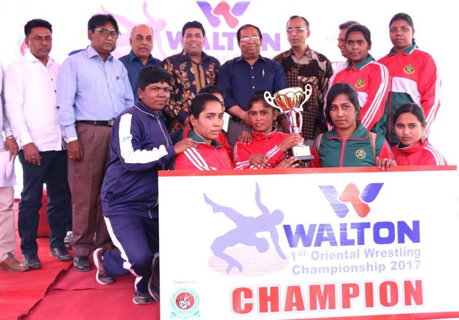 Bangladesh Army, the champions of the Women's Division of the Walton 1st Oriental Wrestling Championship with the chief guest Secretary of National Sports Council Ashok Kumar Biswas and the other officials and guests of Bangladesh Amateur Wrestling Feder