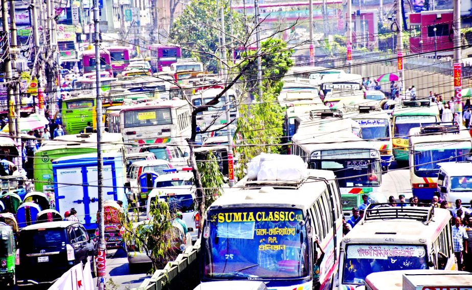 Hundreds of vehicles being stuck from Jatiya Press Club towards Paltan area due to meetings, rallies of various organisations which are a regular phenomena. But the authorities concerned are indifferent to help end traffic congestion. This photo was taken