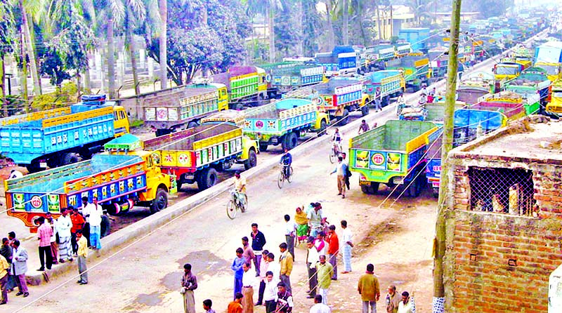 Hundreds of off-loaded trucks got stranded at Benapole land port in Jessore district as an indefinite transport strike in 10 districts of Khulna Division begins on Sunday. This photo was taken from Benapole area on Sunday.