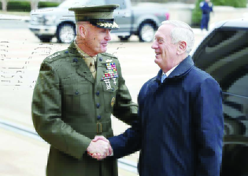 Joint Chiefs Chairman Gen. Joseph Dunford greets Defense Secretary Jimn Mattis at the Pentagon.