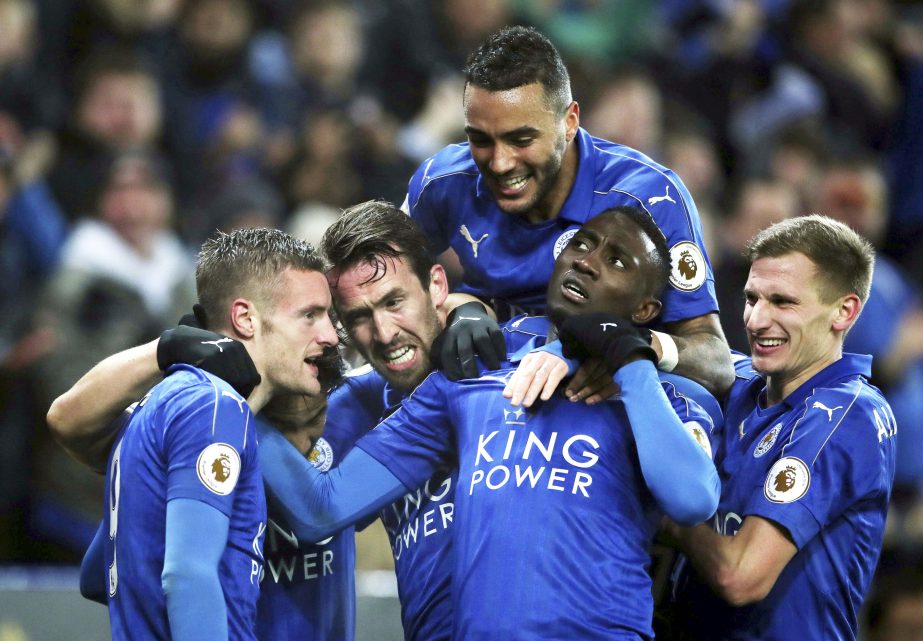 Leicester City's Jamie Vardy (left) celebrates scoring his side's third goal goal during the English Premier League soccer match between Leicester and Liverpool, at the King Power Stadium, in Leicester, England on Monday.