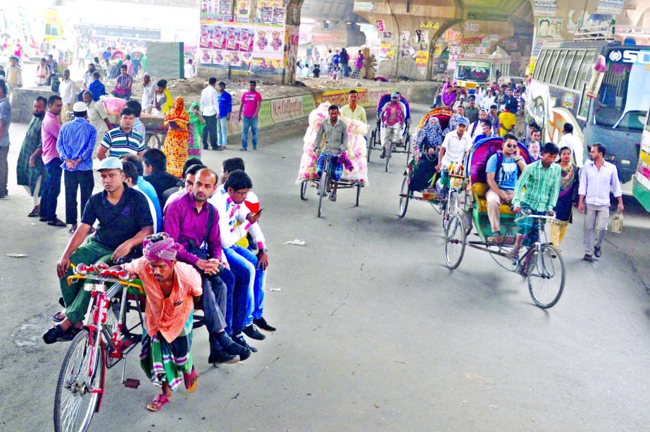 In absence of public transport, city dwellers suffered immensely while rickshawvans took control the roads carrying passengers during hartal hours enforced by left political parties on Tuesday. This photo was taken from Sayedabad.