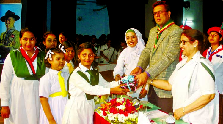 Deputy Commissioner of Dhaka Salahuddin Ahmed distributing prizes among the winners of Girls Guide and Scouts in intellectual development competition at Guide House Auditorium on Tuesday.