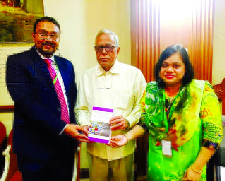 Barrister Ahmed Ehsanul Kabir, Assistant Professor of Law, Jagannath University and Barrister Shuvra Chowdhury, Assistant Professor of Law, Stamford University presenting their book on Media and Cyber Laws to President Abdul Hamid at Bangabhaban on Monday