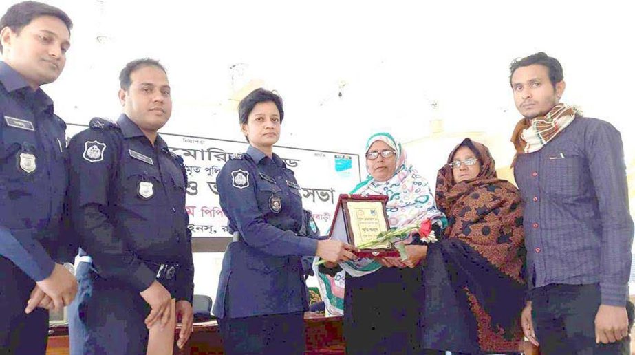 RAJBARI: Salma Begum PPM, SP, Rajbari giving crest to the family members of former police men on the occasion of the Police Memorial Day at Rajbari Police Line organised by Rajbari Police Administration on Wednesday.