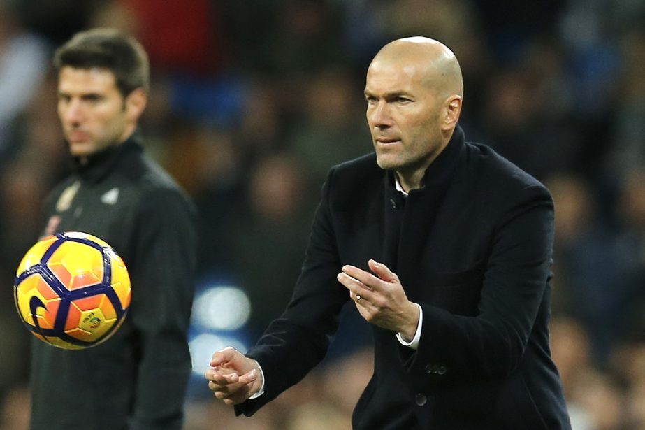 Real Madrid's head coach Zinedine Zidane throws the ball back into play during a Spanish La Liga soccer match between Real Madrid and Las Palmas at the Santiago Bernabeu stadium in Madrid, Spain on Wednesday.