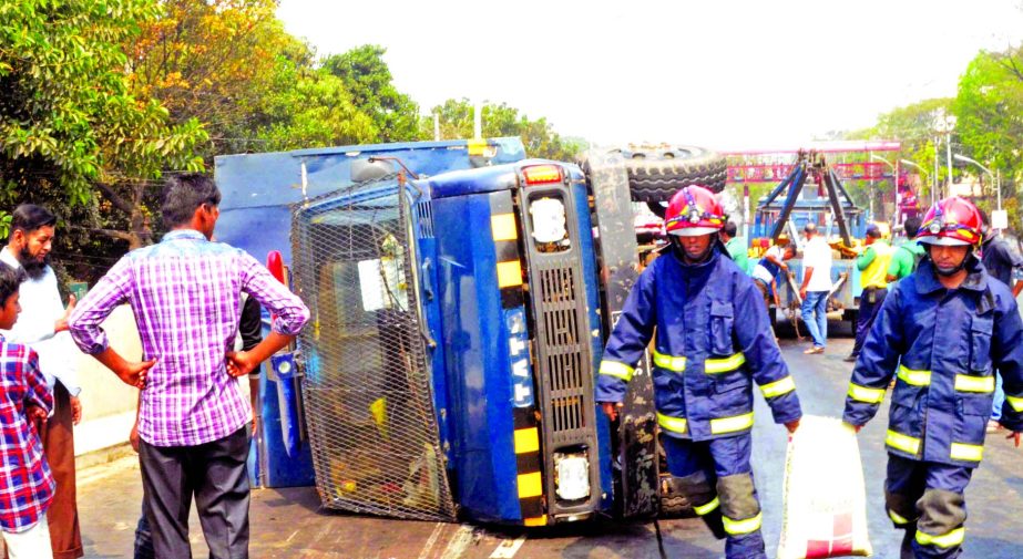 A prison van carrying 24 prisoners overturned near Saat Rasta inter-section in the city as driver lost control over steering, while heading towards Kashimpur jail from Dhaka Central jail in Keraniganj. This photo was taken on Friday.