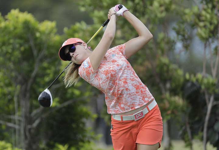 Paula Creamer of the United States tees off on the 3rd hole during the HSBC Women's Champions golf tournament held at Sentosa Golf Club's Tanjong course in Singapore on Friday.