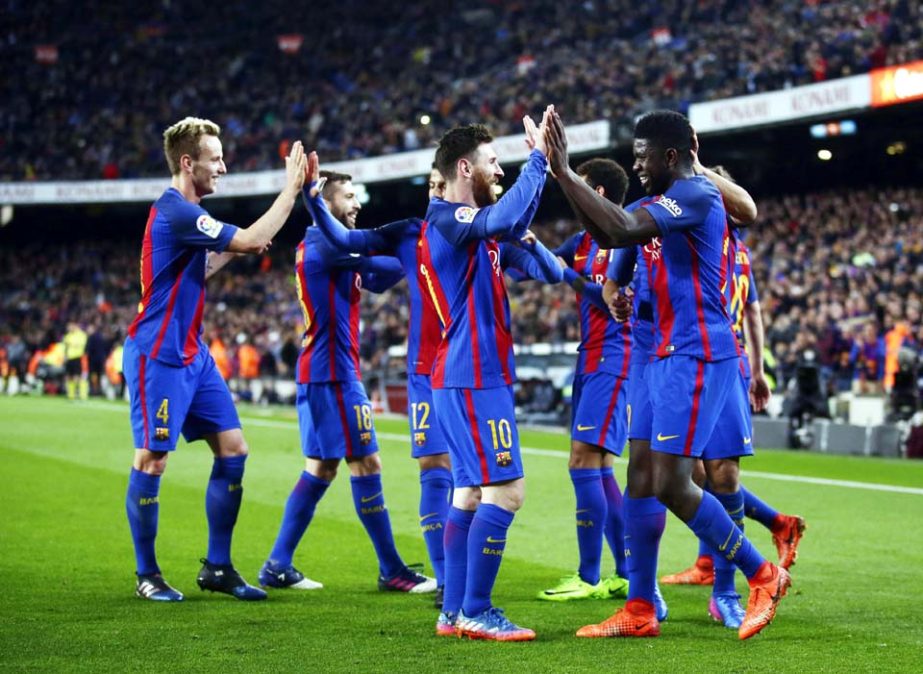 FC Barcelona's Samuel Umtiti (right) celebrates after scoring during the Spanish La Liga soccer match between FC Barcelona and Celta Vigo at the Camp Nou in Barcelona, Spain on Saturday.