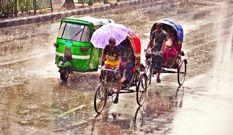 People heave sigh of relief as first shower in the month of Falgun sweeps capital as well as across the country on Sunday. This photo was taken from near the Jatiya Press Club.