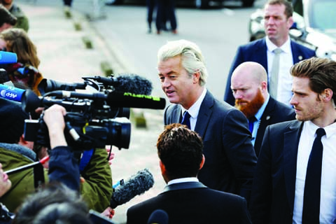 Dutch far-right Party for Freedom leader Geert Wilders speaks to media on Sunday in his campaign for 2017 Dutch elections in Amsterdam.
