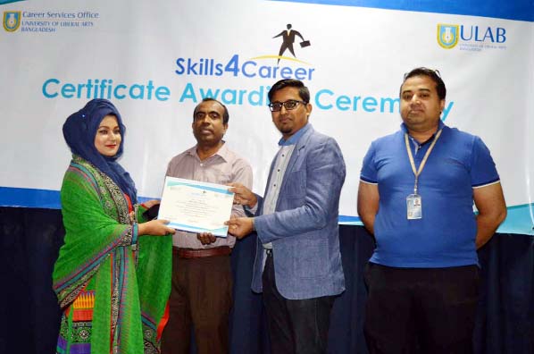 Mohammed Tariqul Islam, Head of Group HR and Corporate Communications and Ashique Mahmood Adnan, Lecturer, School of Business (USB), ULAB distributing certificates among the participants of a career session namely "Skills 4 Career" held at ULAB city cam