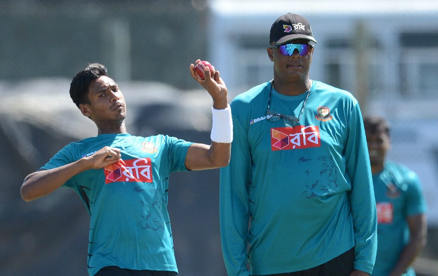 Courtney Walsh watches on as Mustafizur Rahman bowls at Galle on Monday.