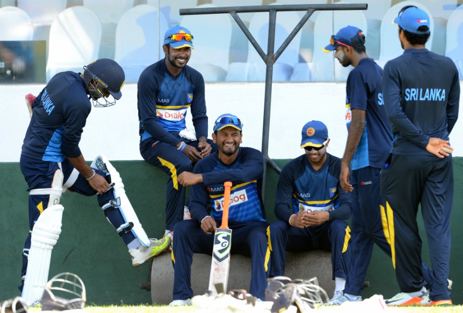The Sri Lankan players relax after a training session at Galle on Monday.