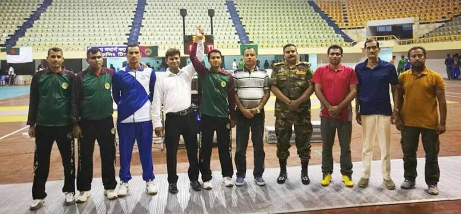 The winners of the 2nd National Fencing Championship with the officials of Bangladesh Fencing Association pose for a photo session at the Shaheed Suhrawardy Indoor Stadium in Mirpur on Tuesday.