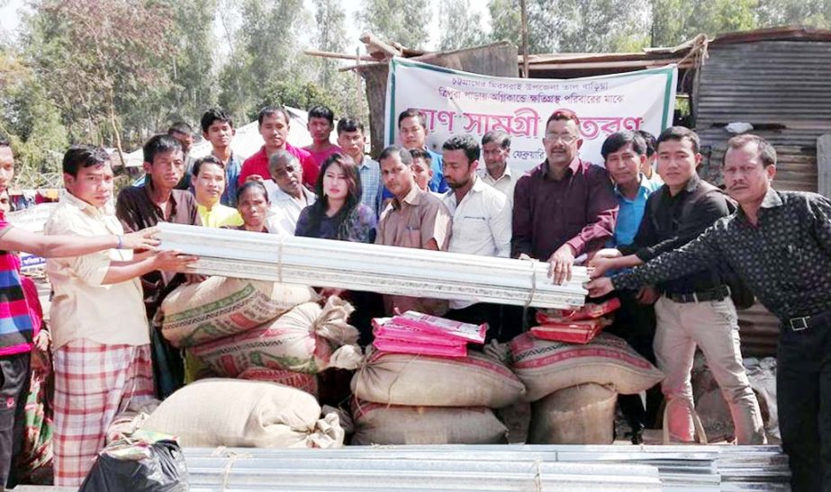 Adul Anita Foundation distributing goods among the fire- affected people in Miressari North Talbaria Tripura Palli recently. Tripura Welfare Mission assisted them to distributing goods.