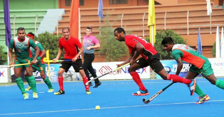A moment of the quarter-final match of the World Hockey League round 2 between Egypt and Bangladesh at the Moulana Bhashani National Hockey Stadium on Thursday.