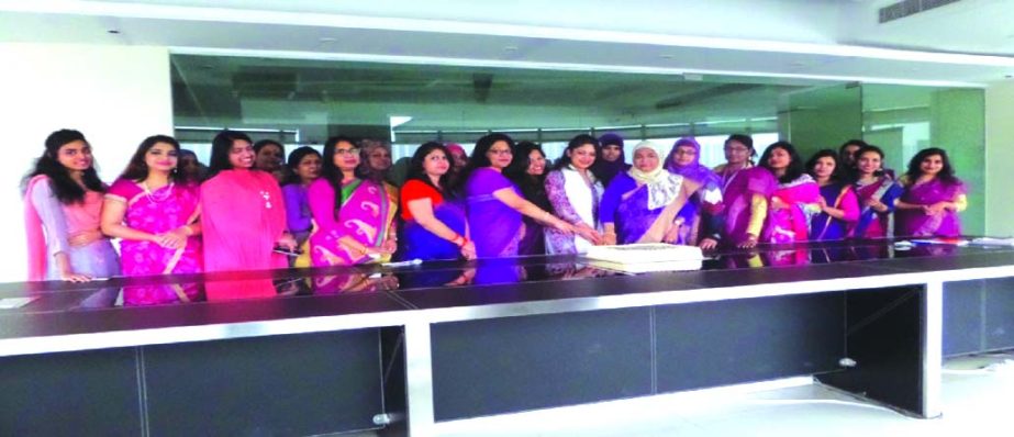 Mohammodi Khanam, CEO of Prime Insurance Company Limited inaugurating the International Women's Day program by cutting cake at its Corporate Head Office in the city on Wednesday. Saheda Pervin Trisha, Director, Rehana Akter Ruma, Head of Corporate Affair