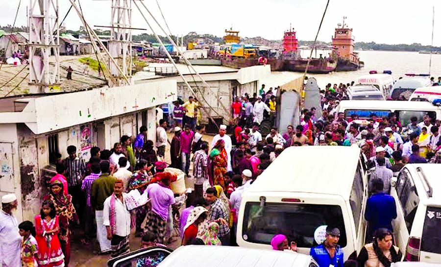 Hundreds of people waiting on both sides of Bhola-Lakshmipur Ferry Ghat due to Ferry crisis causing sufferings to passengers and transport workers. This photo was taken on Thursday.