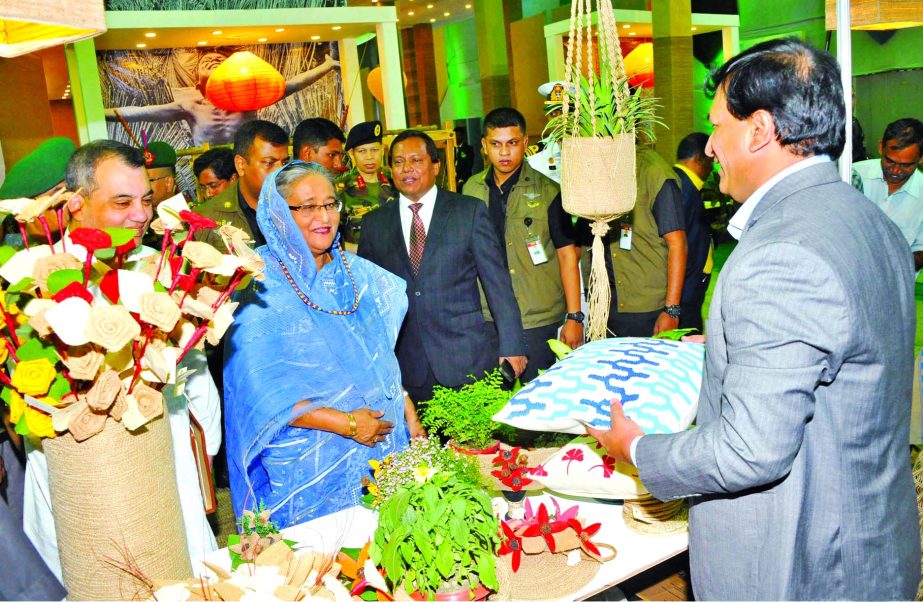 Prime Minister Sheikh Hasina visiting a stall after formal opening of fair of jute goods marking the National Jute Day at the Krishibid Institution in the city on Thursday.