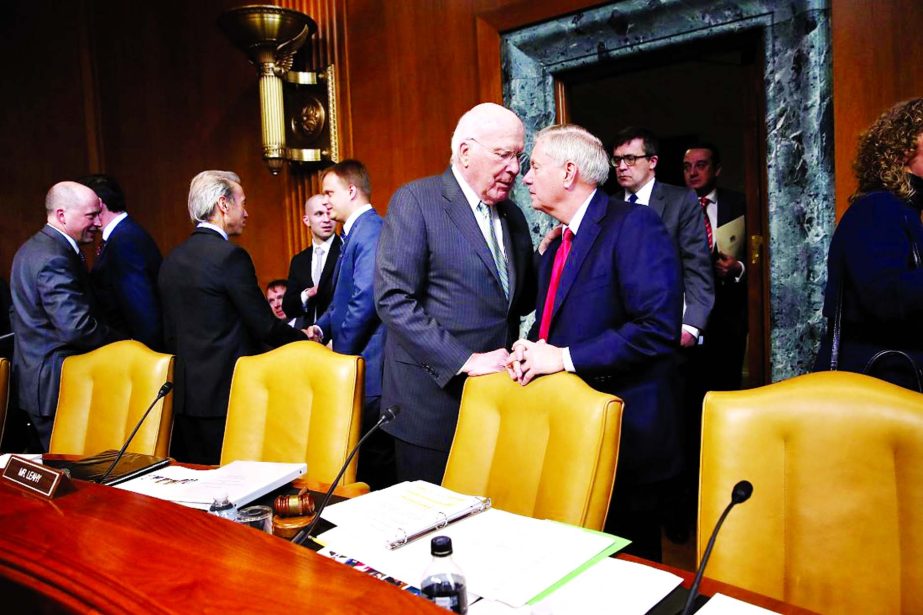 Sen. Patrick Leahy (L) (D-VT) confers with Sen. Lindsey Graham (R-SC) before the start of a hearing held by the Senate State, Foreign Operations and Related Programs Subcommittee in Washington, DC.