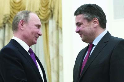 Russian President Vladimir Putin, left, and German Foreign Minister Sigmar Gabriel speak during their meeting in the Kremlin in Moscow on Thursday.