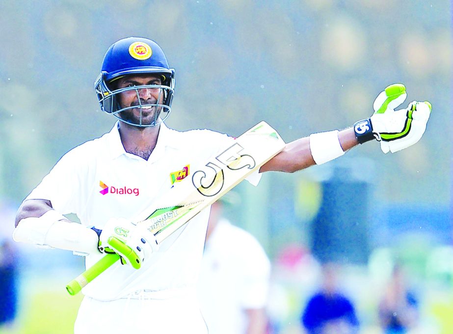 Upal Tharanga gestures after bringing up his century on the 4th day of 1st Test between Sri Lanka and Bangladesh at Galle International Stadium in Sri Lanka on Friday.