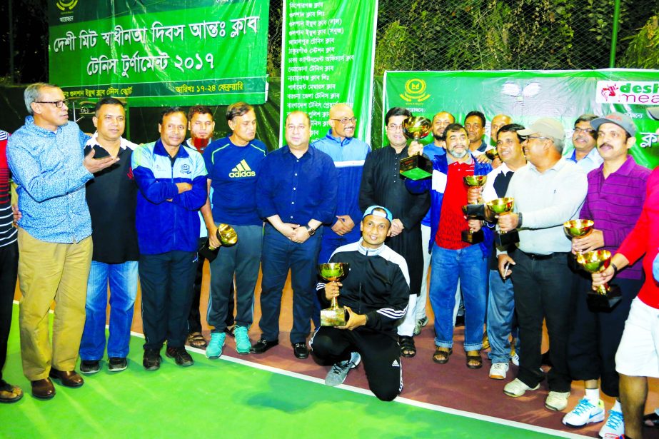 The winners of the 'Deshi Meat Independence Day Inter-Club Tennis Tournament' with the guests Deputy Minister for Youth and Sports Arif Khan Joy, MP, Barrister Sheikh Fazle Noor Taposh, MP and the officials of Gulshan Youth Club pose for a photo session