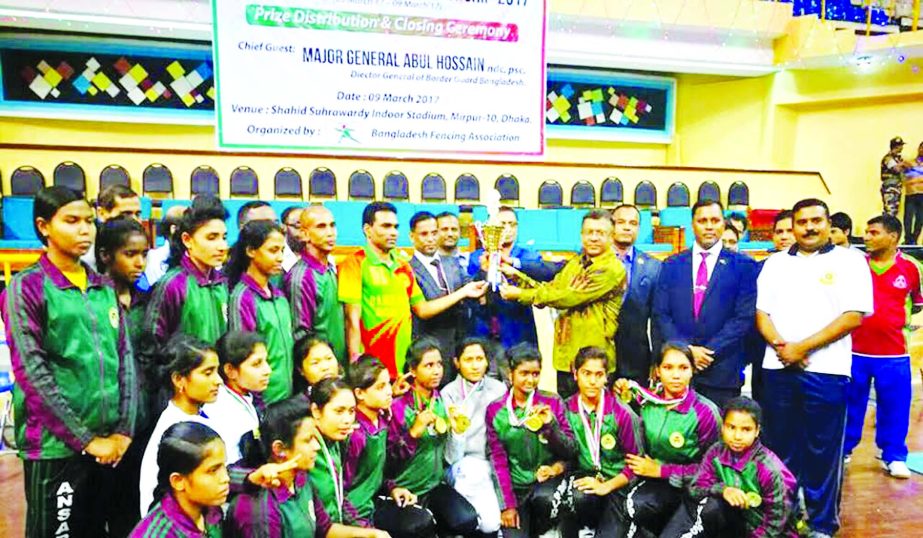 Members of Bangladesh Ansar, the champions of the womenâ€™s division of the second National Fencing Championship with the guests and officials of Bangladesh Fencing Association pose for photograph at the Shaheed Suhrawardy Indoor Stadium in Mirpur on