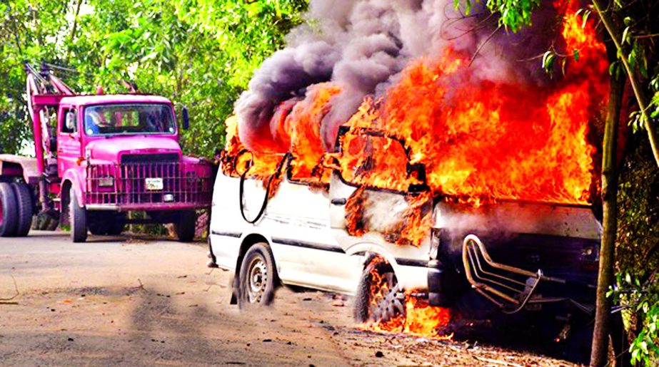 Agitated people torched a microbus carrying policemen at Balutupa Bazar area in Comilla Sadar Upazila as a motorcyclist was killed hit by microbus on Friday morning.