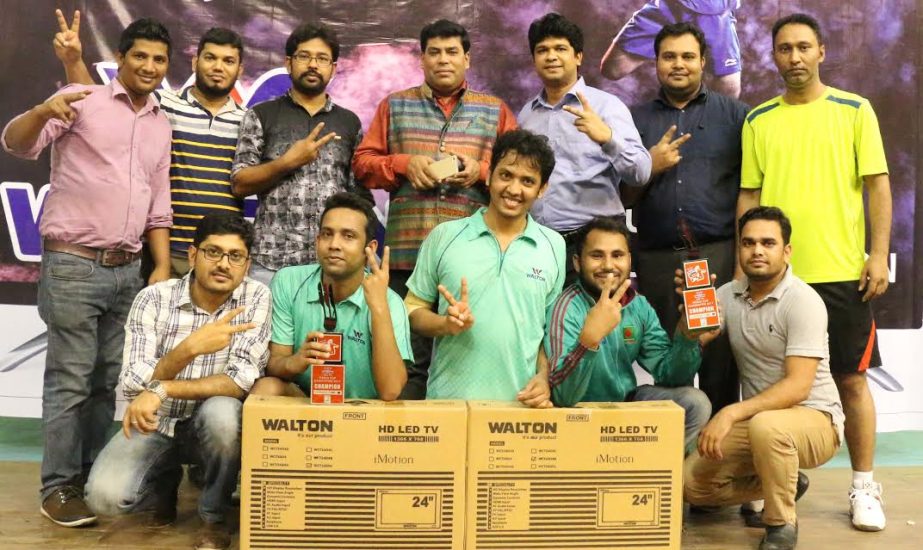 The winners of the Walton LED TV Media Cup Badminton Tournament with the guests and officials of Bangladesh Badminton Federation pose for a photo session at the Shaheed Tajuddin Ahmed Indoor Stadium on Saturday.