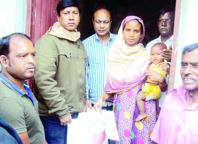 SAGHATA (Gaibandha): Mahbubur Rahman, Chairman Kochuya UP distributing rice at Tk 10 per kg in a Saghat Upazila on Friday.