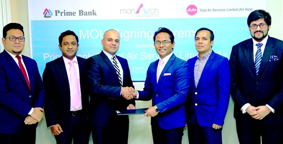 Mamur Ahmed, Senior Vice President, Consumer Banking Division of Prime Bank and Morshedul Alam Chaklader, Director and CEO of Total Air Services Limited (AIR ASIA) exchanging documents after signed a MoU in the city recently. Under the deal, Prime Bank Pr