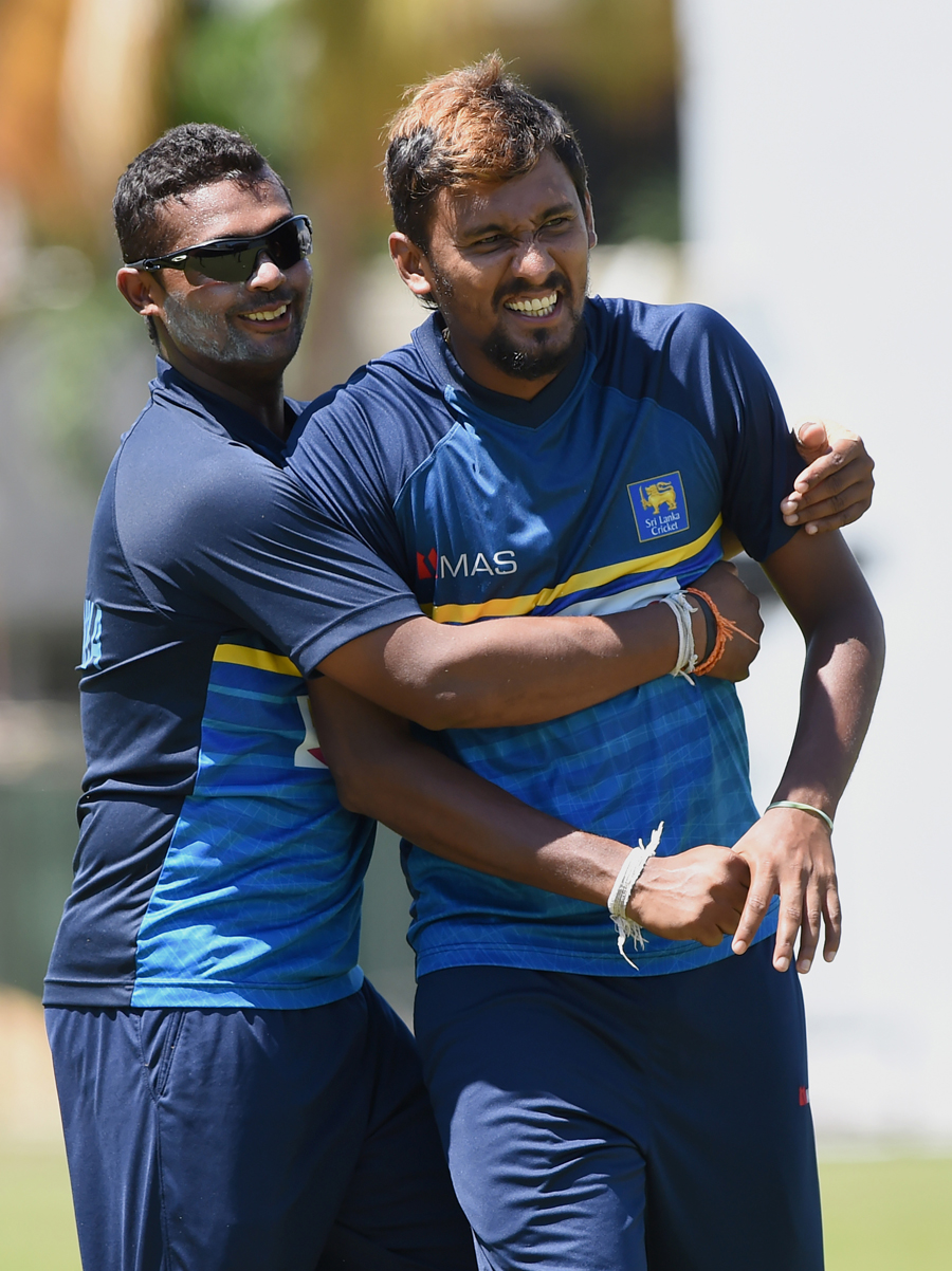 Asela Gunaratne (L) and Suranga Lakmal have a good laugh in training session at Colombo on Monday.