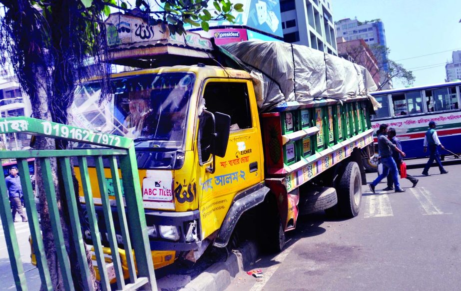 A goods-laden truck rammed into an island in city's Paltan area as driver lost control over the steering on Monday.