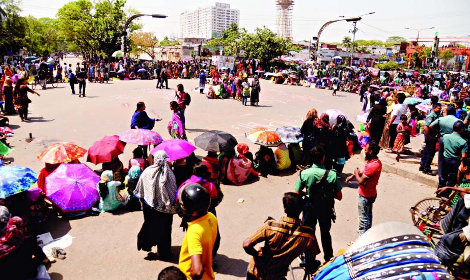 A group of students of the Home Economics College took to the street for about three hours in front of their college at New Market Intersection blocking the road demanding to declare the college as part of Dhaka University Institute.