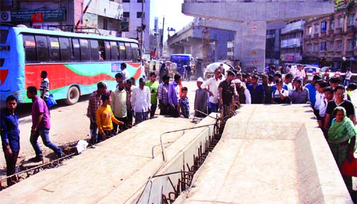 A man was killed and two others including a construction engineer were injured when a concrete girder fell off the under-construction Malibagh-Mouchak flyover on Rly level-crossing in the city early Monday.