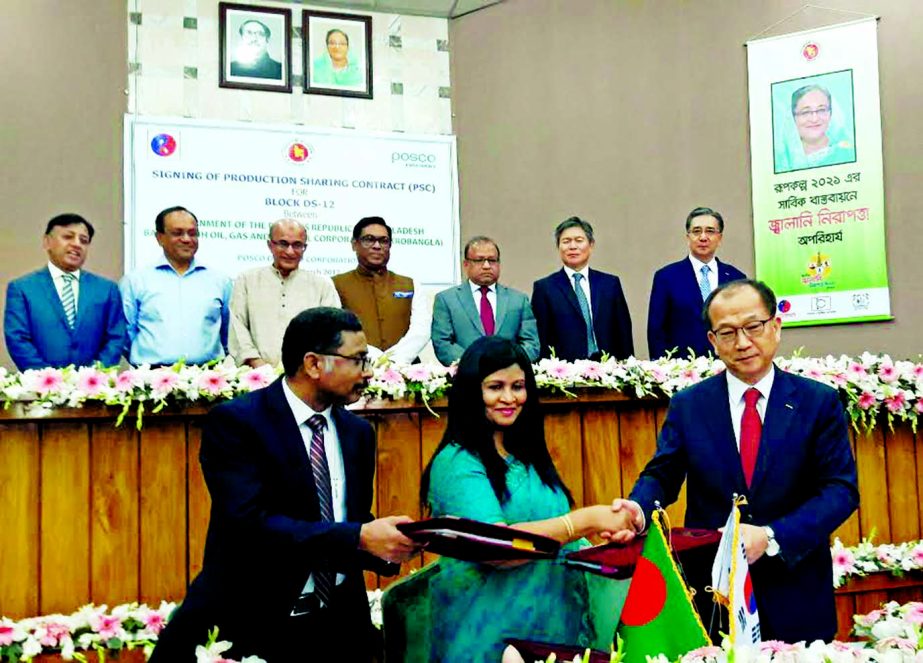 Begum Khadiza Najnin, Deputy Secretary of Minarel Resources Division, Syed Ashfaquzzaman, Petrobangla Secretary and Si Bo Joo, Senior Executive Vice President of Posco Daewoo International Corporation of South Korea exchanging documents after signed a dea