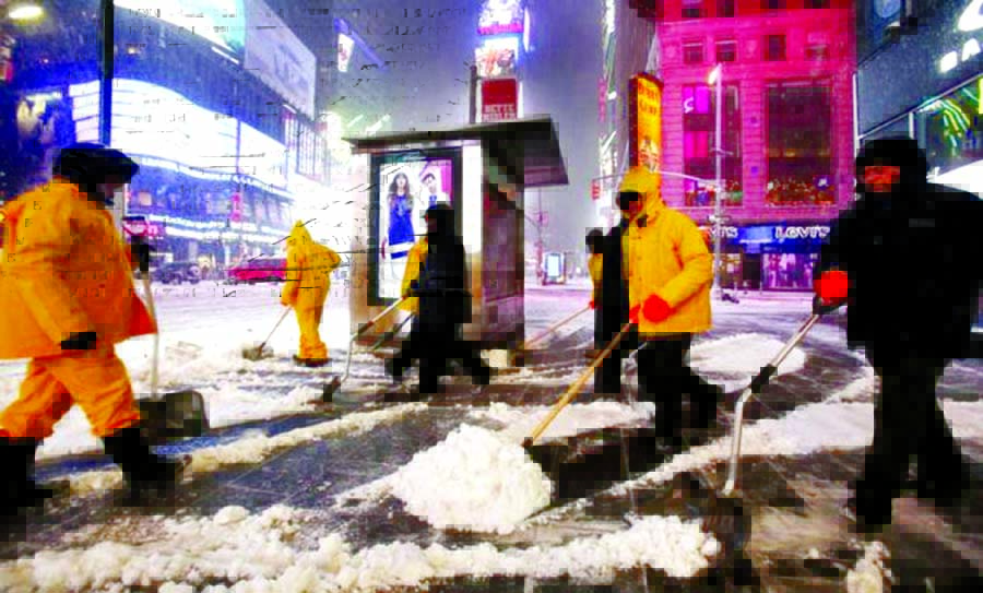 Snow shovellers are out in force in New York's Times Square. Internet photo